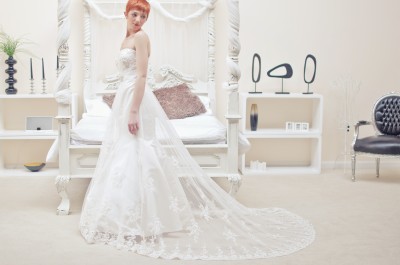 Lace and tulle dipped base neckline, fit and flare wedding dress with beautiful duchess satin mermaid wedding dress shaped lining. Absolutely stunning.