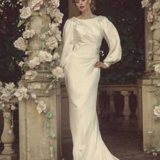 Bateau Neckline Satin long sleeve wedding dress with statement back. Estilo Moda Bridal shop in Milton Keynes Bateau Neckline Satin long sleeve wedding dress with statement back. Great Gatsby wedding dress. art deco wedding dress. 1920s wedding dress. Vintage wedding dress